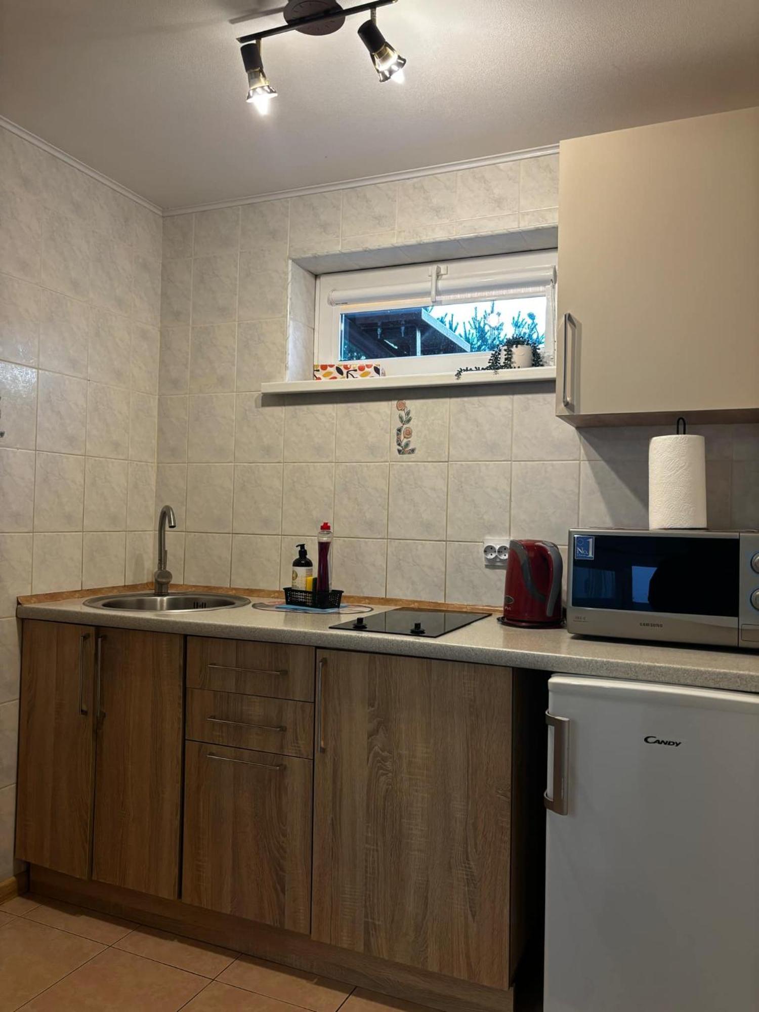 Апартаменти Kotedzas Ніда Номер фото